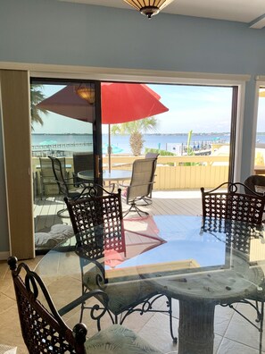 Dining room looking out onto beach/pool view from main deck 