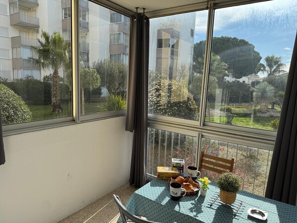 Loggia overlooking the park and bathed in sun in the morning