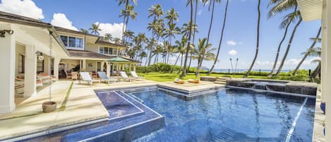 Luxurious pool area with views of the beach