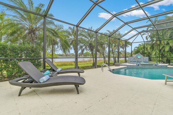 VILLA MARGARETHA - Private heated pool with waterfall, covered outdoor seating and dining area, lounge area and BBQ Grill complete the large screened lanai.