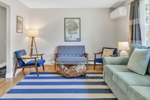 Seating area with driftwood coffee table . & A/C.