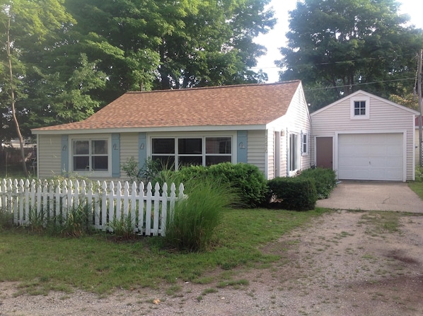 One story mid century cottage. Lots of flowers. Garage to store your bikes!