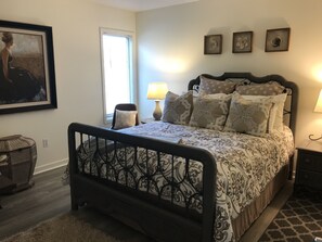 Comfortable Queen bed and seating in Master bedroom.