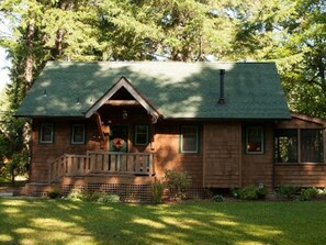 Side view of cabin and front entrance. River is on the right, but close.