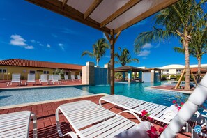 Plenty of shade around the pool . We provide beach towels for you