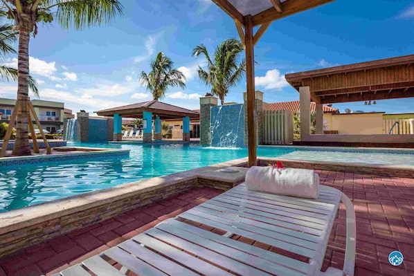 Plenty of lounge seats arund the pool of The Pearl 