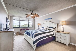 Master King bedroom with views of the complex pool & bay.