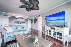 Living room with wood tile flooring and a Smart flat screen TV to make for great night of movies and popcorn!