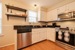 Functional kitchen equipped w/ dishwasher & electric range