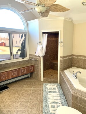 Master bath shower. Easy access , seat inside,  and  two shower heads 