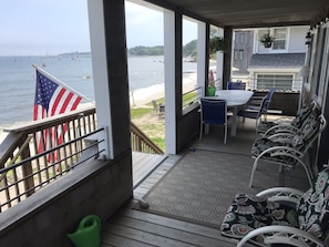 Beautiful covered front porch overlooking ocean and beach