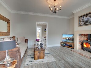 Tastefully furnished living room with wood burner | Amber Waves, Seahouses
