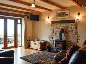 Cosy living room with wood burner | Beudy Bach, Cilgwyn, near Caernarfon
