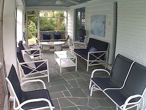 Side porch - covered and screened.  -facing south.