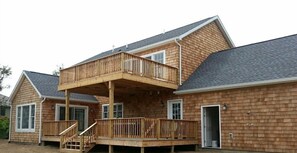 Back of house with double decks overlooking the 13th fairway of Montauk Downs