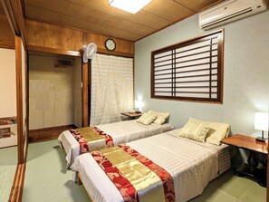 ・[2LDK Private Room (Okinawan)] Two single beds in a tatami room. Futons are also provided.