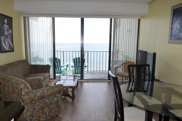 Living & Dining Area with Ocean View & Balcony Access