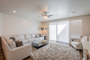 Family Room View - The living room is conveniently adjacent to the kitchen. There is also access to the back patio which has a BBQ grille suitable for all your favorite BBQ dishes.