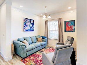 Sitting nook with recliner chairs adjacent to living room & kitchen 