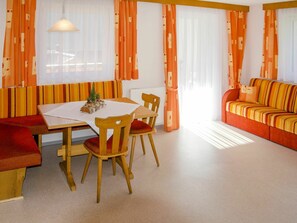 Room, Furniture, Property, Orange, Interior Design, Table, Curtain, Floor, Window Covering, Building