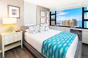 Bedroom with queen-size mattress on adjustable base (raise the head and foot part of the mattress), Ocean Views, and TV