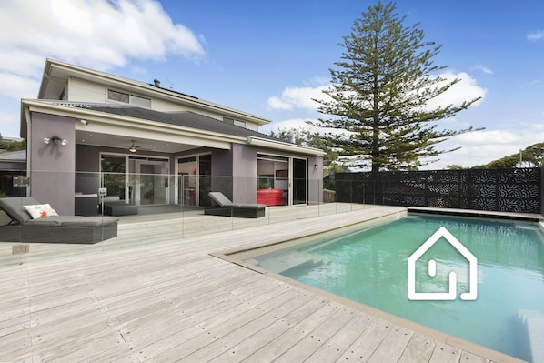 The backyard offers a completely private north facing deck and stunning pool