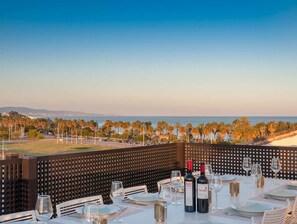 Outside dining table in holiday rental penthouse