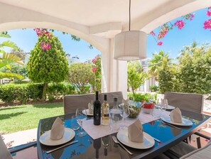 Stylish alfresco dining table with pool views