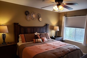 Master Bedroom with King-Size Bed and Ceiling Fan.