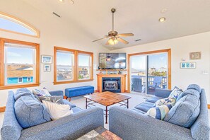 Top-Level Living Room with Deck Access **Fireplace seen in the photo is not operational