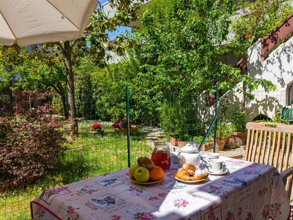 Plant, Table, Food, Furniture, Property, Tableware, Green, Chair, Outdoor Table, Tablecloth