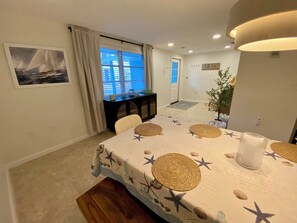 Entryway and dining room flow nicely into the open style kitchen and living room