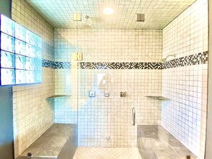 Enjoy showering for the day in the double rain-head steam shower