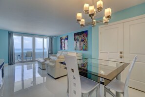 Dining area with counter height table and chairs for optimal ocean views.