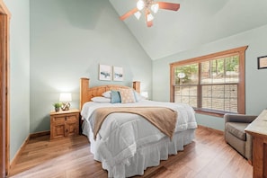 Two master bedrooms with king beds, dressers, smart TVs and attached master bathrooms.