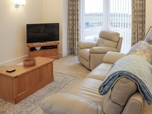Comfortable living room | Rhunahaorine Cottage, Tayinloan, near Tarbert