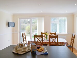 Kitchen/diner with sliding doors to the garden | Driftwood, Port Isaac