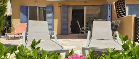 Large terrace overlooking the pool 
With sunbeds for a relaxing holiday