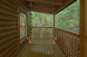Front porch swing, enjoy sounds of the birds and the breeze in mountains.