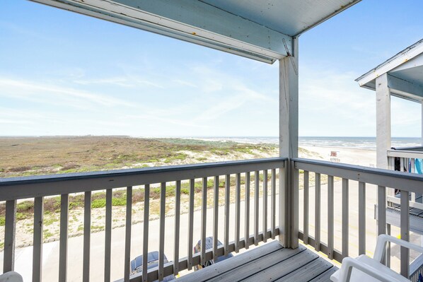 Enjoy the Texas breeze on this private balcony with a Beach view