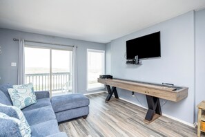 Charming living space with beautiful views and new shuffle board to play with the family