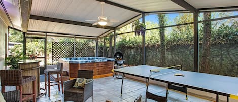 Your group will enjoy the screened in patio with pin pong, darts, hot tub & more