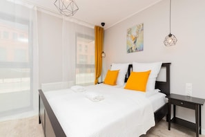 Living area with comfortable double bed.