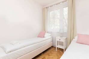 The serene bedroom offers a comfortable double bed for a restful night's sleep.