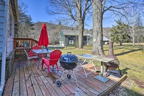 The deck has a view of the vast Catskill mountains and a charcoal grill!