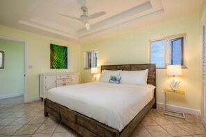 Your King Master bedroom with en-suite bathroom, closet, safe, ceiling fan, AC