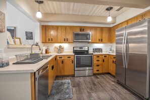 Fully stocked kitchen with new appliances.