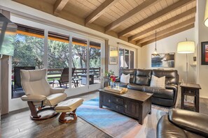 Living Room: Relax on the reclining leather couch and chairs.