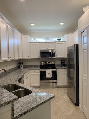 Kitchen with granite counters and stainless steel applicances