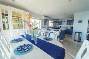 Open plan kitchen and dining area with marina views.